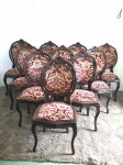 Conjunto de dez cadeiras medalhão em jacaranda com assento e encosto duplo com estofado em tecido aveludado floral. Med. 104x48x48 cm.