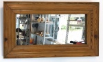 Espelho com moldura em Pinho de Riga. Med. 81x45,5 cm.