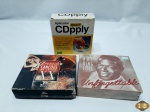 Lote composto de box com 5 cds Grandes Canções do século XX, Box com 5 cds do Nat King Cole e 1 aplicador cdpply.