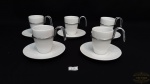 Jogo  de 5 xicaras de cafe em porcelana branca. alça em metal .Medidas. xicara de cafe ,6 cm altura e 4 cm de diametro.