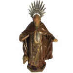 Santo Antônio Abad, em madeira. Apresenta resplendor em prata. 58 cm de altura (sem resplendor). 70 cm de altura (com resplendor).