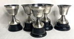COLEÇÃO -Conjunto contendo: 5  trofeus de metal espessurado a prata, Torneios, 1959,1955, 1963 e 1957, medindo: 12 cm alt.
