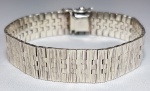 Elegante bracelete em prata de lei com design contemporâneo, unissex. Med. 17.5 cm.