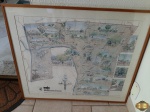 Quadro com mapa do safari Mala Camerserve, com moldura em madeira e vidro frontal. Medindo a moldura 71cm x 84cm. Paspatur apresenta marcas de mofo.