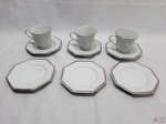 Jogo de 3 xícaras de chá com 6 pires em porcelana Schmidt facetada, friso prata.