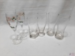 Lote composto de 2 taças flute, 3 tulipas e 1 copo longo em vidro incolor. Medindo as taças 19,5cm de altura.
