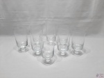 Jogo de 8 taças longas de água em cristal incolor, pé disco. Medindo 15cm de altura.