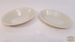 2 Travessas Ovais Fundas Em Vidro Opalinado Colorex.Medida:21 cm comprimento x 14 cm largura x 2,5 cm altura21 cm comprimento x 14 cm largura x 3,5 cm altura , apresenta pequenos bicado na borda.