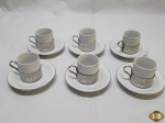 Jogo de 6 xícaras de café em porcelana pozzani com suporte em aço inox e pires em porcelana Schmidt.