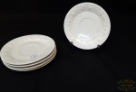 4 pratos pires porcelana  com bordas  decoradas com uvas. medida 14,5 cm diametro, sem marca