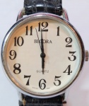 BECORA - Elegante relógio de pulso suíço, a quartz, com caixa em  aço e pulseira em couro. Med: 4,5 cm. Obs.; no estado possivelmente bateria.