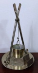 Curioso cinzeiro em metal prateado com copo de vidro e porta fósforos . Mede: 24x14 cm