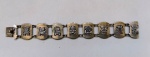 Belíssima pulseira PERUANA em PRATA 900 com representações culturais do país . Mede: 15 cm de diametro