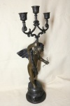 PETIT BRONZE - Delicado candelabro em pettit bronze, representando "QUERUBIM'. Alt. 51 cm.