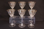 CRISTAL EUROPEU -  Lote composto de 6 taças para vinho, em cristal europeu translucido, borda com friso dourado. Alt. 18 cm.