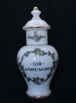 Pote de farmácia no feitio de balaústre em demi cristal opalinado em tom branco leitoso com ricos frisos dourados. Identificador ("SIR DE GRENADE") em negro, emoldurado com arabescos também em dourado. Alt.: 32 cm. (Em função da fragilidade, recomendo o envio em caixa de isopor).