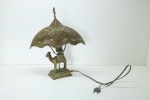 Antigo abajur em de mesa em bronze, com base retangular, corpo representando dromedário, cúpula em metal dourado, lavrado, vazado com acabamento estrela e crescente. Envelhecido naturalmente. Med. 38x30x10 cm.