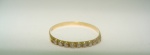 Anel Aparador Meia Aliança Em Ouro Amarelo 18k, Com 9 Diamantes, Peso: 0.6g Valor de Mercado: R$ 1.000,00
