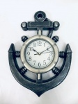 Relógio em formato de âncora, em plástico, à pilha, não testado. Med. 38x29 cm. 