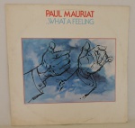 DISCO VINIL - "PAUL MAURIAT - WHAT  FEELING" (1983). Capa e disco em bom estado.
