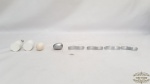 8 puxadores em aço escovado  e melanina, sendo 5 aço escovado , 3 melanina .Medidas: maior 5cm de comprimento, menor 2cm de comprimento