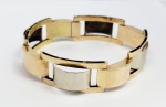 PULSEIRA EM OURO 18 K BRANCO E AMARELO ESTILO E ÉPOCA ART DECO. CONTRASTES PARA EUROPA. DATADA DE 1923. 18 CM DE COMPRIMENTO. 21,9 G.