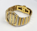 PIAGET MODELO  POLO   ROBUSTO RELÓGIO EM OURO 18K (CAIXA E PULSEIRA) NAS TONALIDADES BRANCA E AMARELA. FUNCIONAMENTO A QUARTZ. ACOMPANHA CERTIFICADO. 28 X 25 CM. 115 G