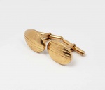PAR DE ABOTOADURAS EM OURO 18 K. ESTILO E ÉPOCA ART DECO. FEITIO DE ELIPSE. 1,8 CM DE ALTURA. 7,9 G