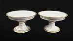 COMENDADOR LUIZ GOMES FERREIRA  PAR DE FRUTEIRAS EM PORCELANA COM DECORAÇÃO ESTILO  E ÉPOCA RESTAURAÇÃO, REINADO CARLOS X DA FRANÇA. DECORADO COM ROSÁCEA EM OURO NA CALDEIRA, DELIMITADA POR MOLDURA EM OURO. A BORDA TEM LARGO BARRADO EM OURO, SUCEDIDA POR FRISO AZUL DELIMITADO POR FRISO EM OURO. A BASE SEGUE A MESMA DECORAÇÃO PORÉM POSSUI RESERVAS COM BRASÃO DE ARMAS DO COMENDADOR E LEGENDA EM LATIM SOLA NOBILITAS VIRTUS. EM LETRAS GÓTICAS INICIAIS DO PROPRIETÁRIO LGF. FRANÇA, DEC. 1820. 21 CM DE DIAMETRONOTA: foi um Rico negociante estabelecido em Londres, depois no Recife, tendo como residência o Palácio Mondego (demolido, ficava na atual Rua Visconde de Goiana, antiga rua do Cotovelo, no bairro da Boa Vista. No local encontra-se hoje o Colégio Salesiano Recife); conhecido como "Lord Esporas", por andar com esporas de ouro pelas ruas do Recife. O DIÁRIO DE PERNAMBUCO, de quarta-feira, 26 de fevereiro, n 329, ano de 1834 traz o seguinte anúncio: "Precisa-se de um feitor que saiba podar, enxertar, e tudo o mais de seu ofício, dá-se de comer, e bom ordenado, quem estiver nestas circunstâncias. Dirija-se ao Mondego, sítio de Luiz Gomes Ferreira. Em 1821 o Comendador foi baleado no Recife, quando acompanhava o Governador da Província, Luiz do Rego Barreto, ocasião em que os pernambucanos voltavam a rebelar-se contra a Coroa portuguesa. Casou-se em primeiras núpcias com Francisca Mariana do Espírito Santo, que  faleceu   no Recife. Desse casamento nasceu LUIZ GOMES FERREIRA (CHAMADO 3. POR SER PRECEDIDO DE SEU PAI E BISAVÔ HOMÔNIMOS). LUIZ GOMES FERREIRA NETO, filho do COMENDADOR LUIZ GOMES FERREIRA foi Chefe de Gabinete do Duque de Caxias, quando foi ministro da Guerra e Presidente do Conselho de Ministros do Império entre 1861 e 1862. O segundo casamento do COMENDADOR LUIZ GOMES FERREIRA foi registrado em 1821 na Cidade do Recife com dona  EMÍLIA CONSTANÇA DE MORAES SILVA a encomenda desse aparelho provavelmente foi feita por ocasião dessas núpcias.