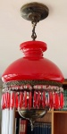 Lustre estilo lampião para 2 lampadas, com estrutura em metal e bronze, manga em vidro com tom vermelho, pingentes em cristal branco e vermelho, (Obs. Faltam 2 pingentes) medida total aprox. 58 x 30 cm de diam 