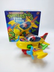 Glasslite - Antigo Brinquedo Teco Teco com tema da Tartarugas Ninja a corda em sua caixa muito bem conservada, manufatura Glasslite, Funcionando