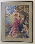 bordado em petit point com cena de mulher na natureza emoldurado em caixa com vidro. 75A x 57L.