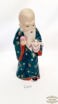 Escultura sabio chines em porcelana representando paz. Medida 21 cm altura.