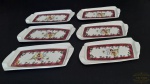 6 Petisqueiras em porcelana. Medida 8X17 cm.