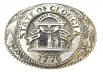 Fivela para cinto alusivo ao `State of Georgia 1776`, produzidas em metal . Medidas: 6,5 cm de comprimento X 9 cm de largura.
