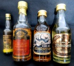 Lote com 04 mini garrafas de bebidas alcoolica `Conde D´EU` ,`OLD EIGHT-extra whisky`, `ANIS DE MONTSERRAL`-possui selo,`Aromas del MONTSERRAL` - Gran Licor-possui selo ,todas garrafas lacradas.