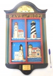 Bela e decorativa placa para parede, produzida em madeira em alto relevo, representando Faróis americanos, medidas: 60 cm de comprimento X 36 cm de largura.