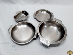 Lote composto de 3 travessas redondas funda e 1 retangular funda em aço inox. Medindo a maior 24cm de diâmetro de boca x 7cm de altura.