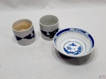 Lote de 2 cachepots para vela em porcelana azul e branco da Zara Home e 1 bowl em porcelana azul e branca. Medindo o bowl 15,5cm de diâmetro x 6,5cm de altura.