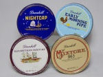 Quatro latas colecionáveis do tabaco inglês Dunhill. Marcas do tempo. 3 x 10cm.