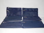 Seis carteiras de mão em corino, confeccionadas pela Business Class como souvenir para a extinta companhia aérea Varig. 13 x 21cm.
