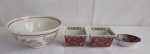 Um bowl, medindo 7cm de altura e 15cm de diâmetro, dois bowls menores, medindo 7x7cm e 5cm de altura, e uma mini travessa em porcelana decorada de origem oriental, medindo 8x5cm e 3cm de altura.