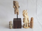 Quatro peças: Ídolo em base de madeira, São Sebastião, pequena figura feminina e carinha de cão de fó.