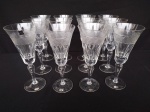 Doze taças de cristal  da marca hering lapidado para champanhe medindo  8  cm de diâmetro e 20 cm de altura.