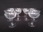 Dez  taças de cristal para champanhe com rica lapidação medindo 9 cm de  diâmetro e 12 cm de altura.
