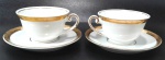 BARÃO DO RIO BRANCO - Par de xícaras para chá em porcelana branca com borda decorada por pintura em ouro na xícara e no pires. Medem 6 x 9 cm cada xícara e 14 cm de diâmetro cada pires.