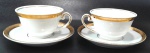 BARÃO DO RIO BRANCO - Par de xícaras para chá em porcelana branca com borda decorada por pintura em ouro na xícara e no pires. Medem 6 x 9 cm cada xícara e 14 cm de diâmetro cada pires.