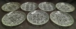 conjunto de 7 pratinhos confeccionados em vidro martelado. medindo 14,5 cm