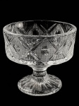 Antiga Uveira de Pé Alto, em vidro prensado, na tonalidade branco translúcido, com decoração variada. Dimensões: 11,5 cm X 12,5 cm (Alt./Diâm.).