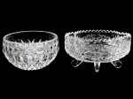 Duas Antigas Petisqueiras, em vidro prensado, na tonalidade branco translúcido, sendo uma oval  com pés quadripóides e outra redonda. Dimensões: 6,5 cm X 12,5 cm X 9 cm(Alt.Comp./Larg.); 6 cm X 11 cm (Alt./Diâm.).